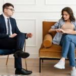 A couple receiving divorce counseling while sitting on a couch.