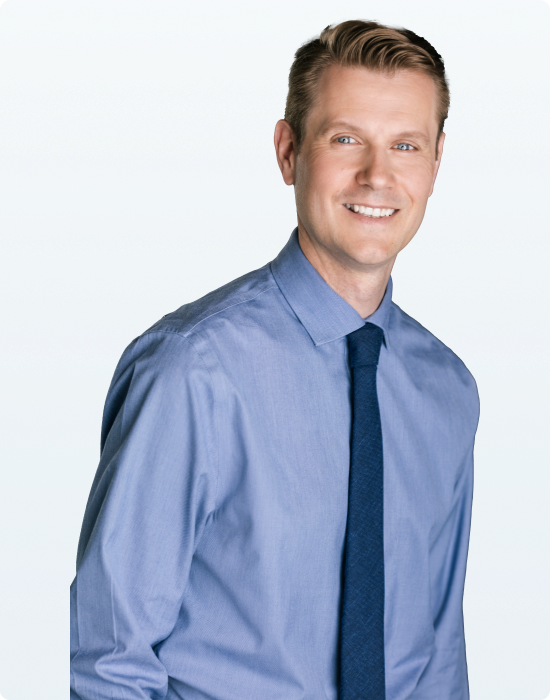 A Surrey counselor in a blue shirt and tie.