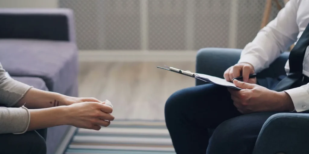 Male counsellor meeting with a client during a DBT session